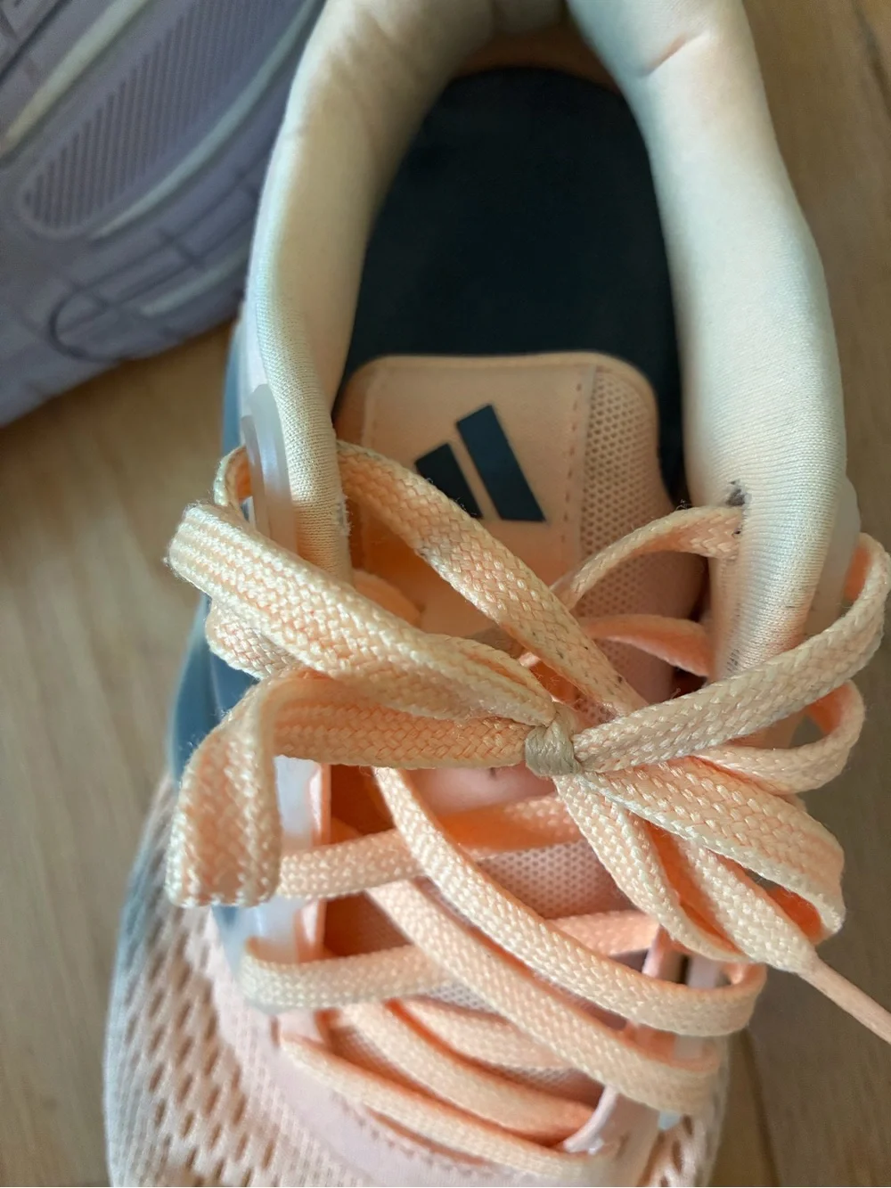 adidas Women’s Peach Athletic Running Shoes with Blue Accent Stripes